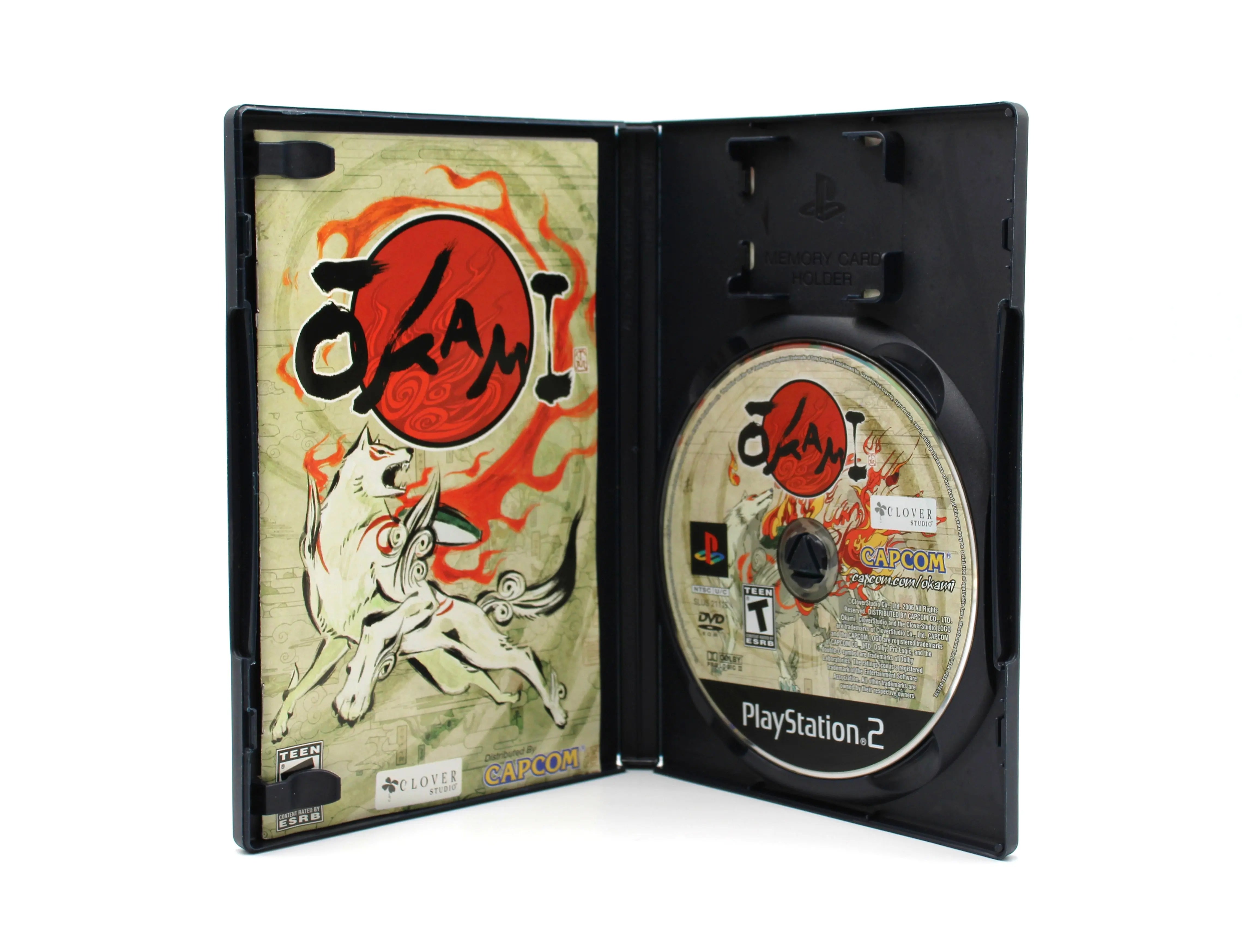 Opened case of Okami PS2 black label edition, NTSC-U region, showing manual and authentic game disc in tray, refurbished and complete set.